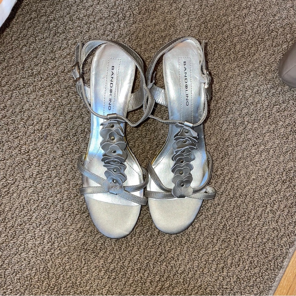 Women’s Bandolino gold wedges with floral accents